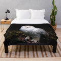 Snowy owl plush blanket with a detailed portrait of the majestic bird