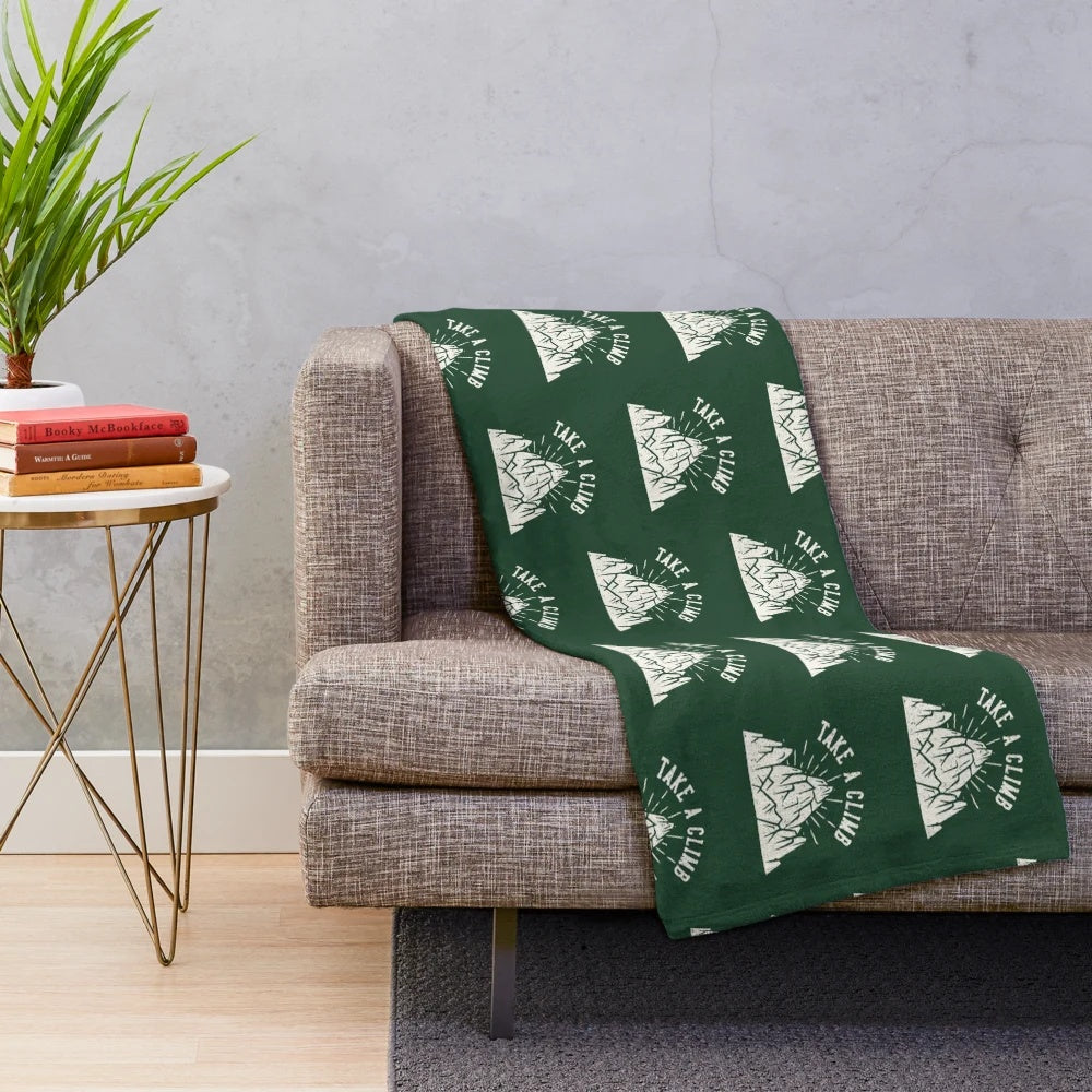 Plush mountain-themed blanket for outdoor enthusiasts