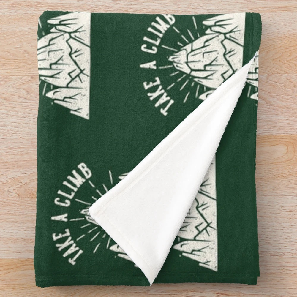 Plush mountain-themed blanket for outdoor enthusiasts