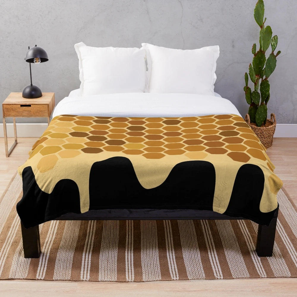 Honey-colored plush blanket with an abstract design
