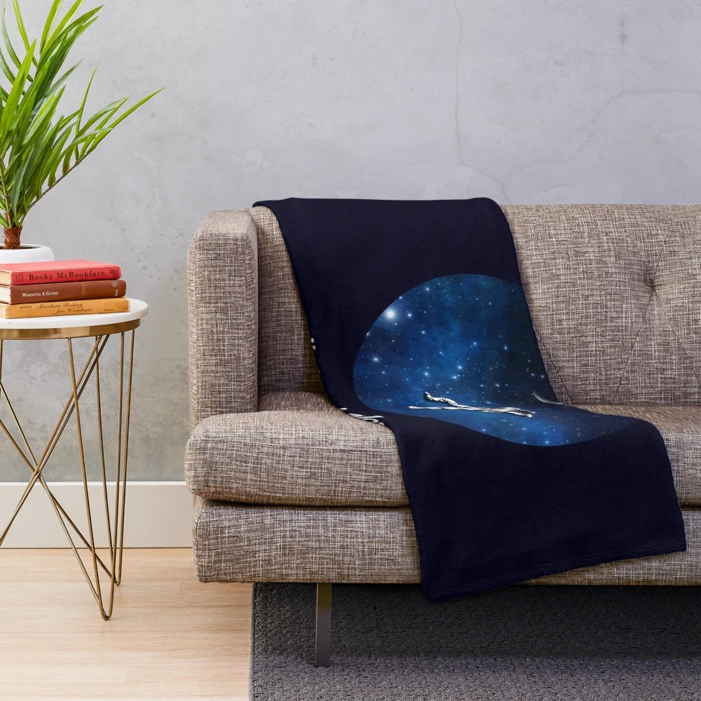 Astronaut-themed plush blanket with stars and galaxy design