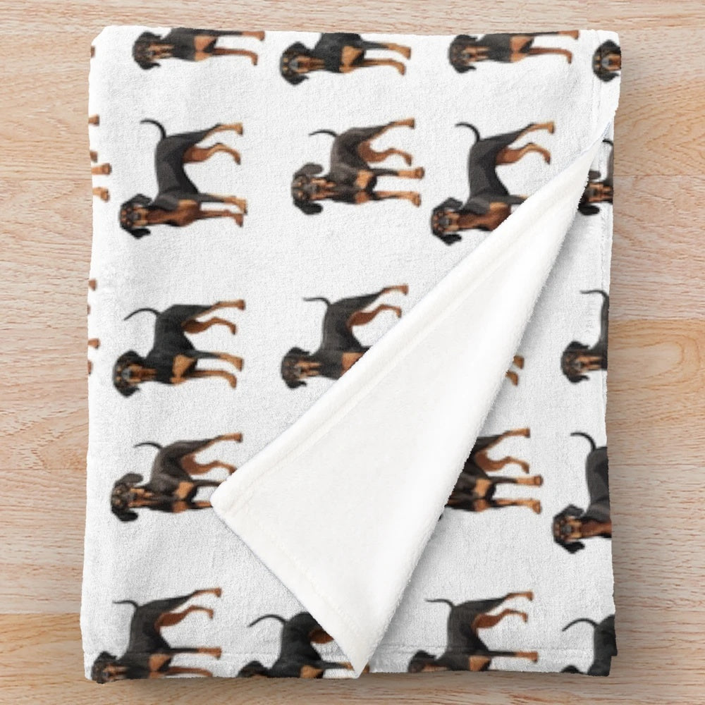 A cozy plush blanket featuring a black and tan coonhound