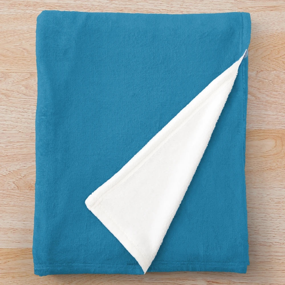 Narwhal plush blanket with a cute blue narwhal design