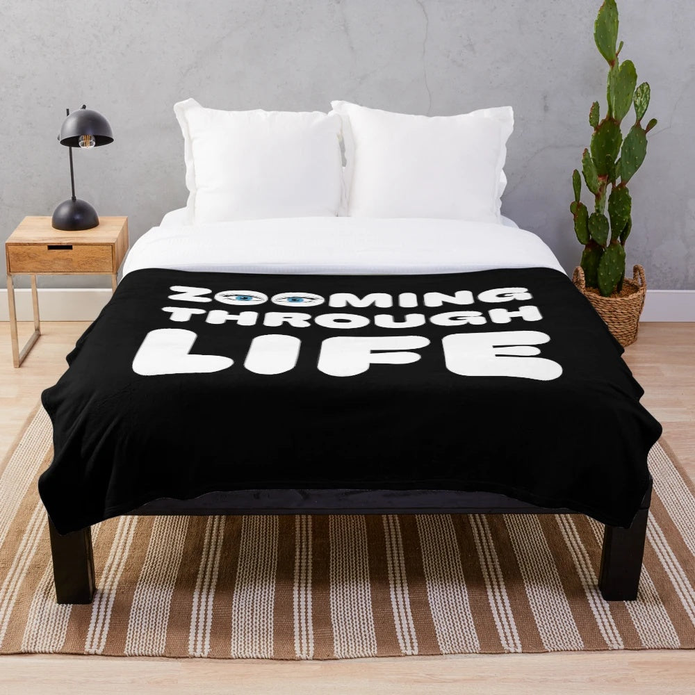 Plush blanket with a photographer-themed design