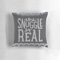A cozy and soft pillow with a "The Snuggle is Real" lettering design