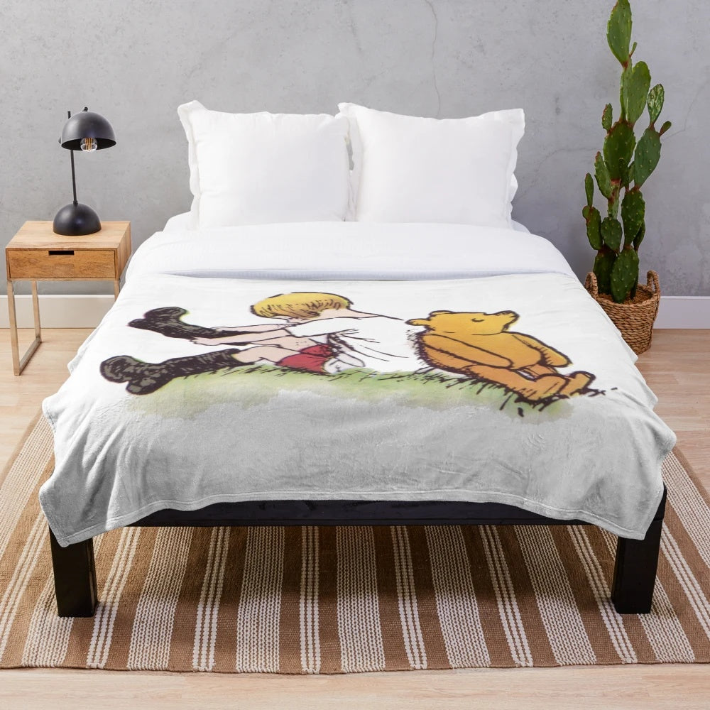 Plush Winnie the Pooh and Christopher Robin themed blanket