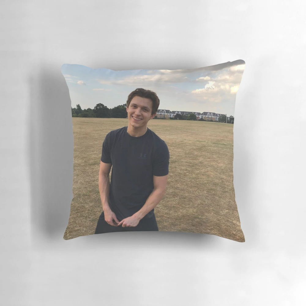 A plush, comfortable pillow featuring a portrait of actor Tom Holland as the superhero Spider-Man.