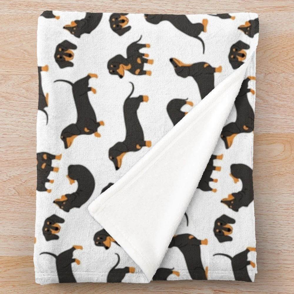 Soft, cozy plush blanket featuring adorable dachshund dogs