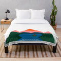 Cozy plush blanket featuring a mountain landscape, perfect for snuggling up with someone special.