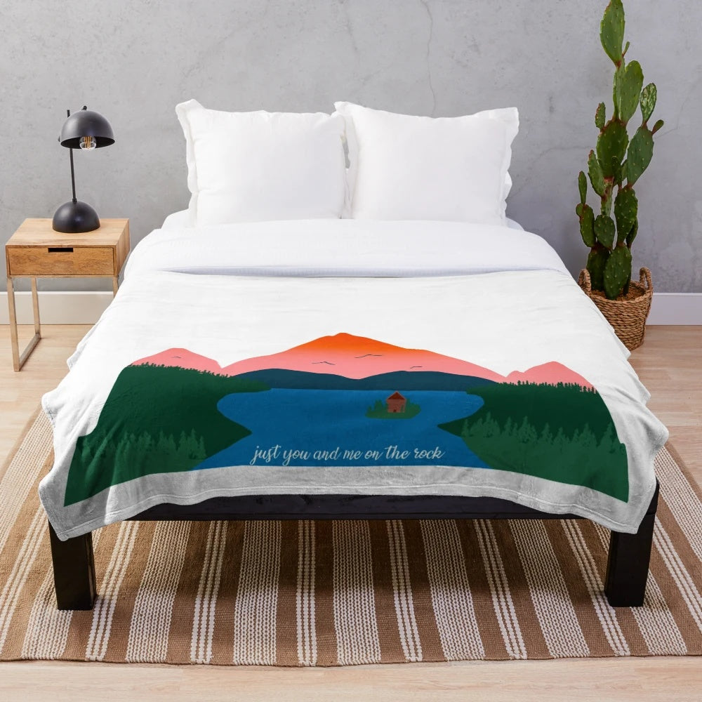 Cozy plush blanket featuring a mountain landscape, perfect for snuggling up with someone special.