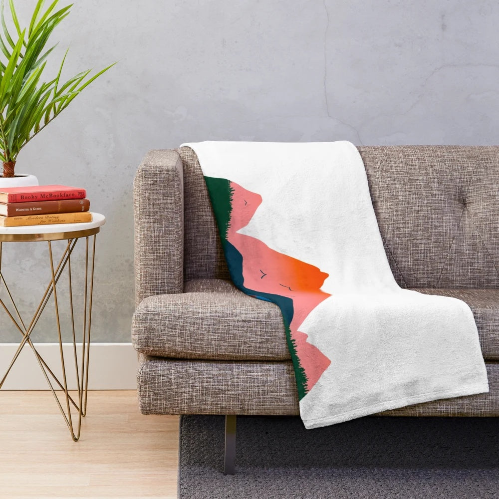 Cozy plush blanket featuring a mountain landscape, perfect for snuggling up with someone special.