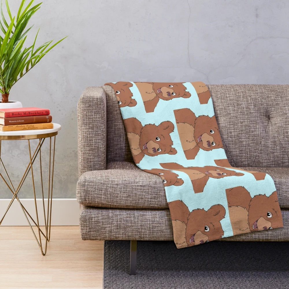 Nickelodeon inspired plush blanket featuring a soft, cuddly brown bear design