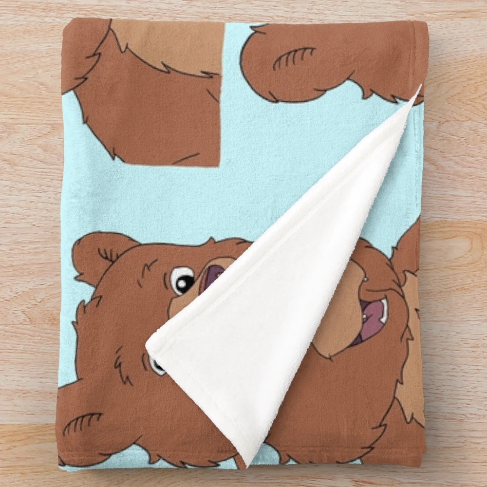Nickelodeon inspired plush blanket featuring a soft, cuddly brown bear design