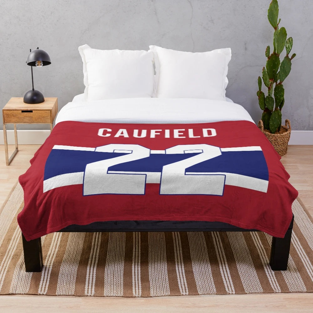 Soft and cozy plush blanket featuring a hockey theme for sports enthusiasts