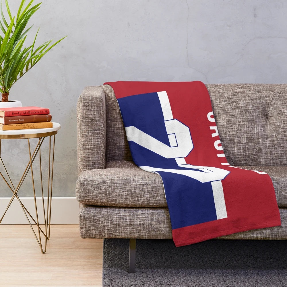 Soft and cozy plush blanket featuring a hockey theme for sports enthusiasts
