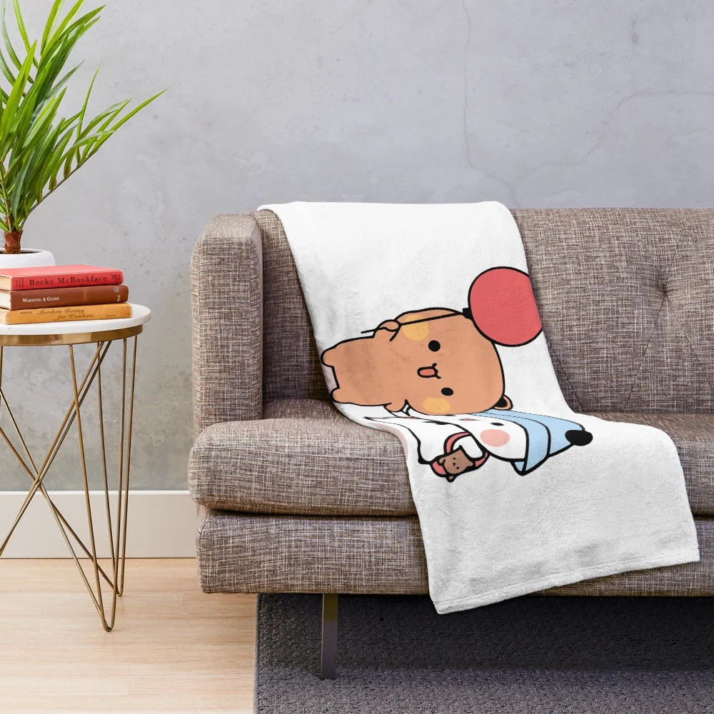 Soft and cuddly plush blanket featuring a cute bear and panda design