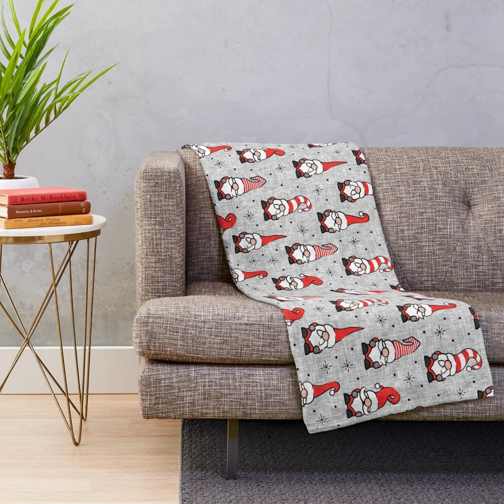 Grey plush blanket with festive Christmas gnomes