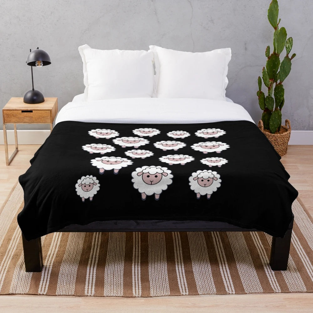 A plush blanket featuring a herd of cute, cartoon sheep