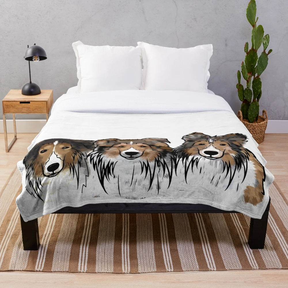Soft and cuddly plush blanket featuring three adorable Sheltie dogs