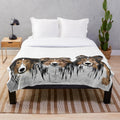 Soft and cuddly plush blanket featuring three adorable Sheltie dogs