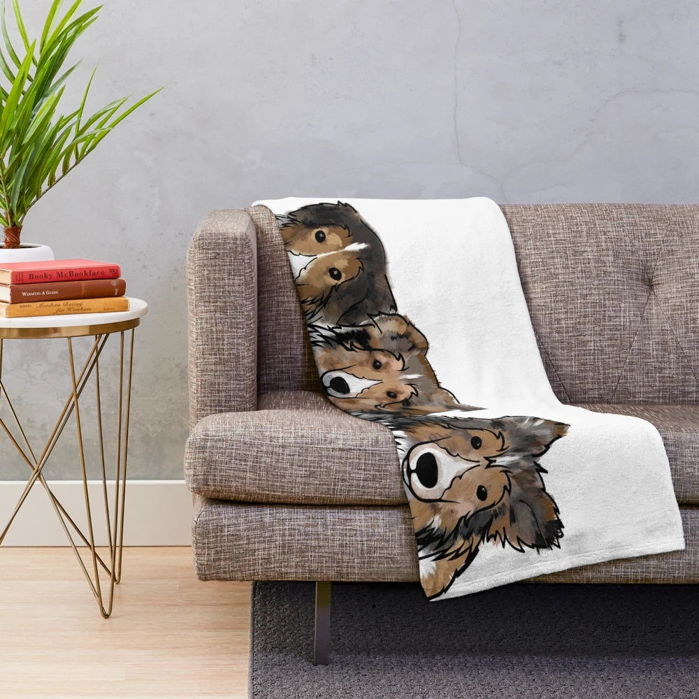 Soft and cuddly plush blanket featuring three adorable Sheltie dogs