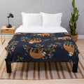 Cozy sloth and flower print plush blanket for relaxing and napping