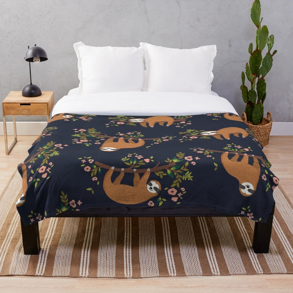 Cozy sloth and flower print plush blanket for relaxing and napping