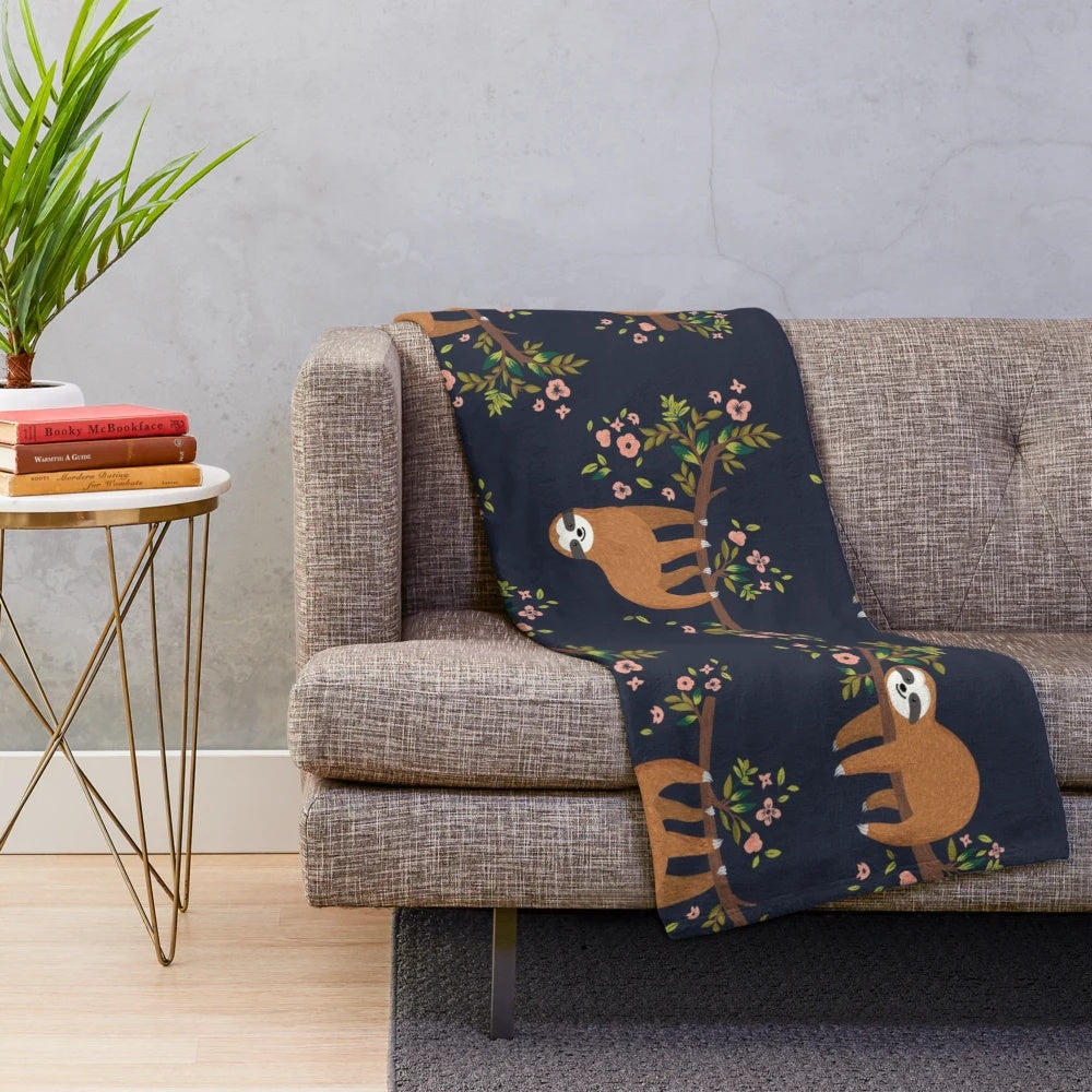 Cozy sloth and flower print plush blanket for relaxing and napping