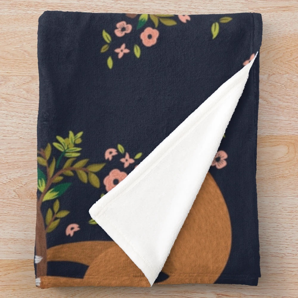 Cozy sloth and flower print plush blanket for relaxing and napping