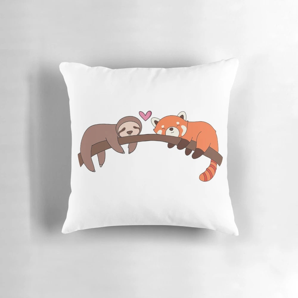 Plush pillow featuring a cuddling sloth and red panda design