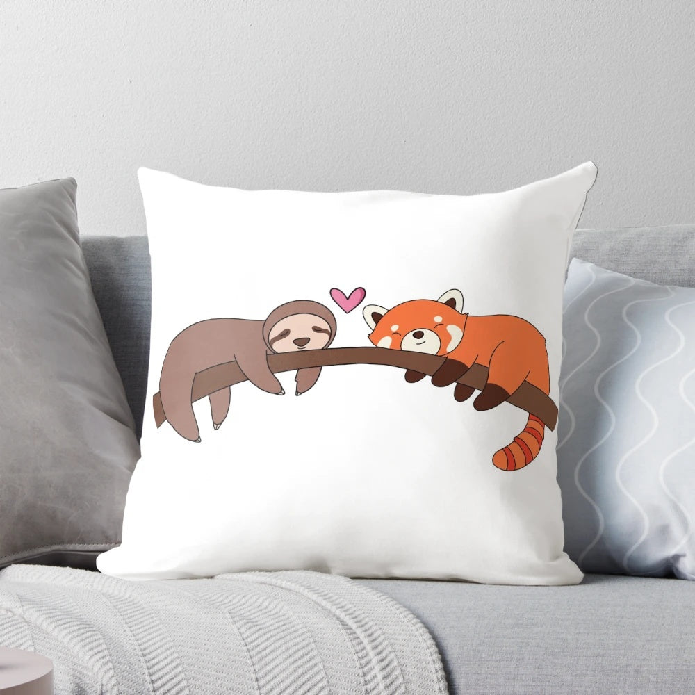 Plush pillow featuring a cuddling sloth and red panda design
