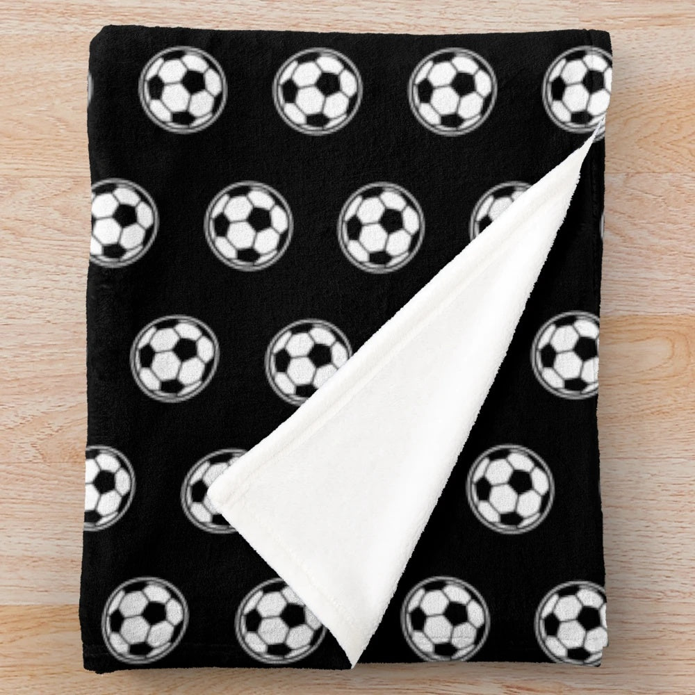 Soccer ball and football themed plush blanket