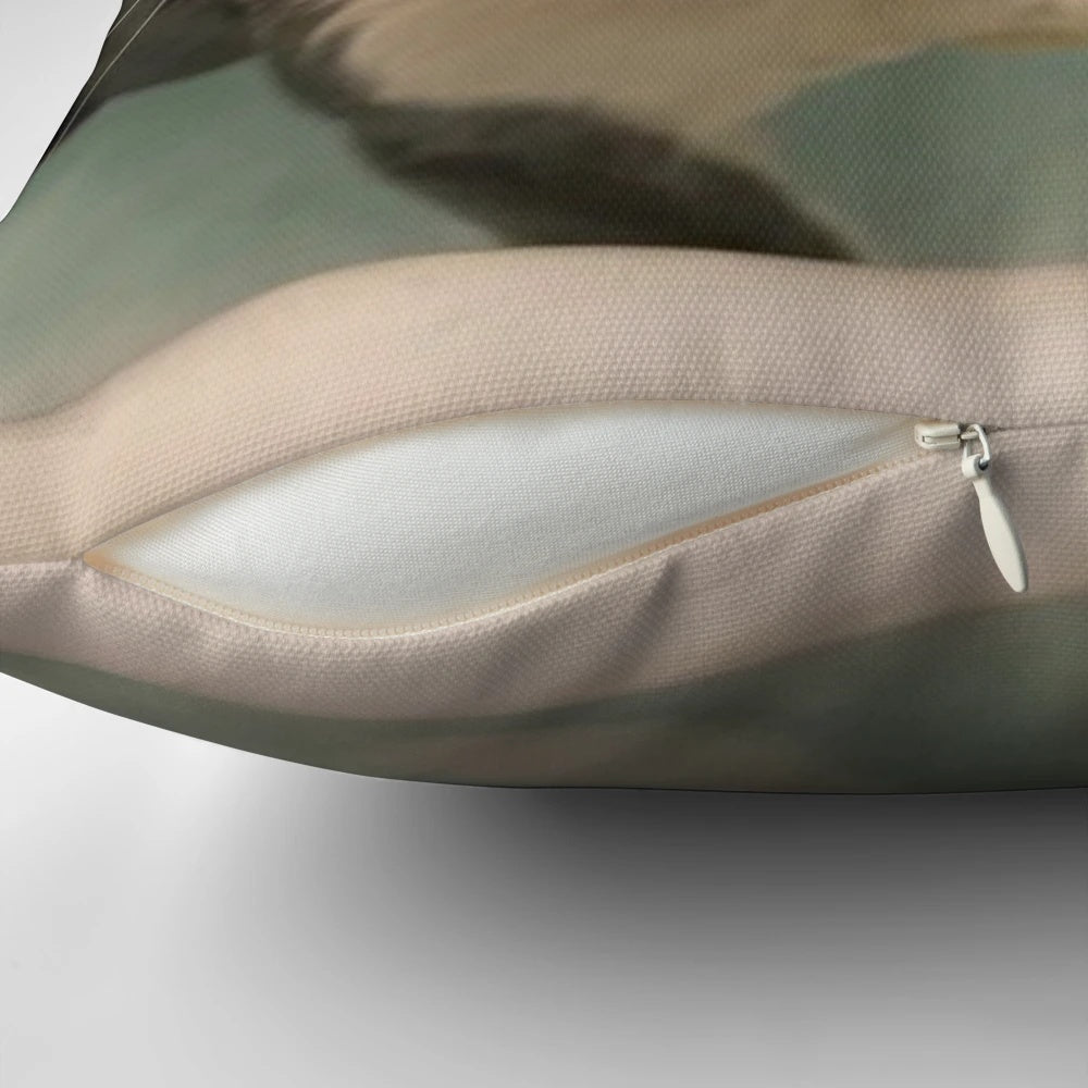 Plush, soft pillow with an image of a wet, playful cat curled up on it