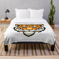 Closeup of a soft, plush tiger-patterned blanket