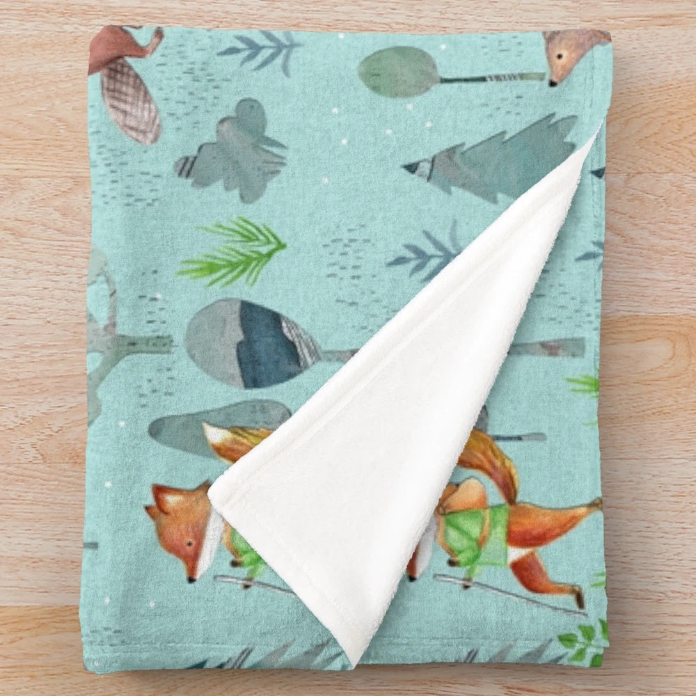 Cozy plush blanket with woodland forest animals