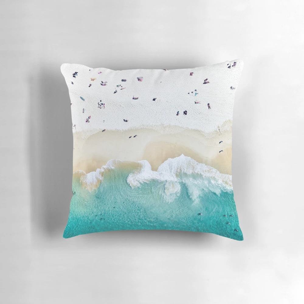 Summer-inspired pillow with beach and surf motifs