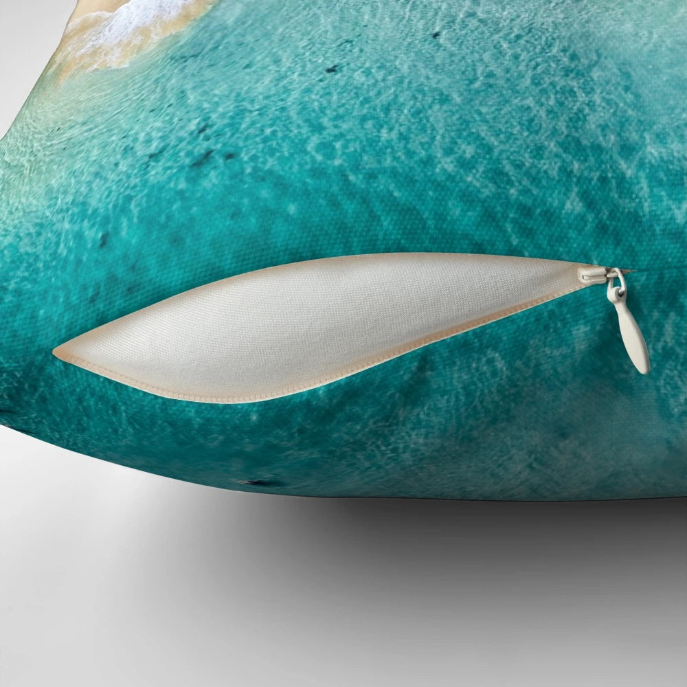 Summer-inspired pillow with beach and surf motifs