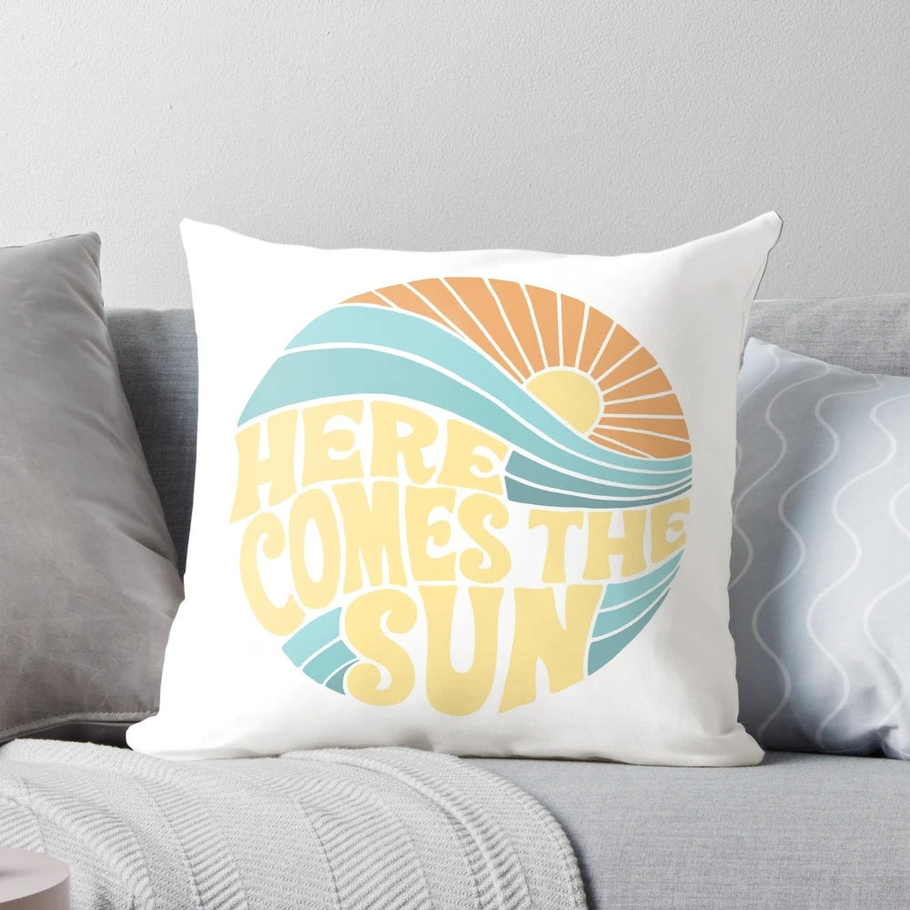 Colorful and vibrant 'Here Comes the Sun' pillow featuring sunshine, ocean, and summer vibes