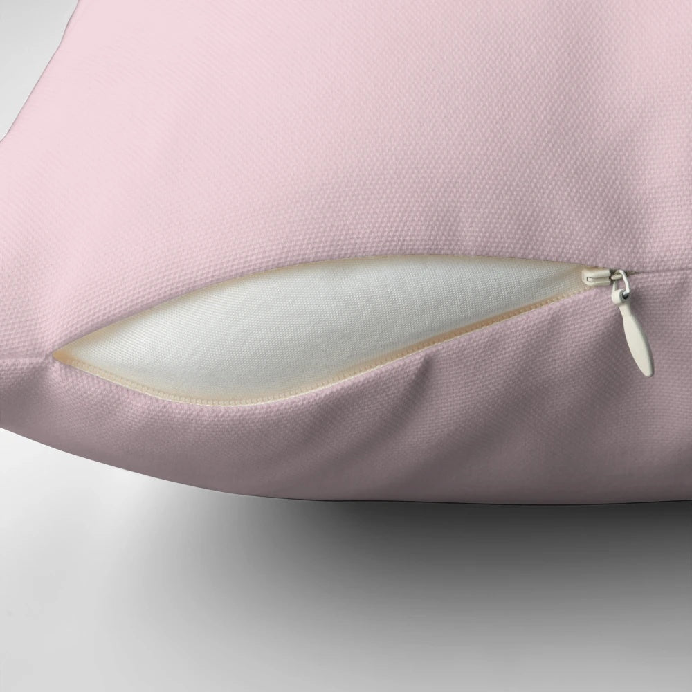 Soft and plush blush pink pillow with a luxurious cotton candy feel