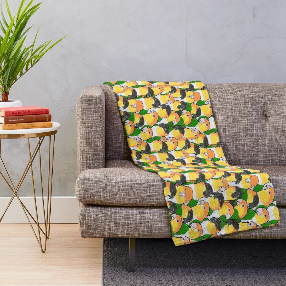 Soft and cuddly plush blanket featuring a cute caique parrot design