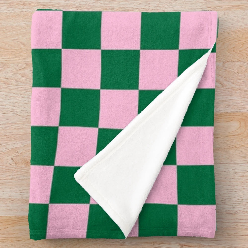 Soft and cozy cotton candy pink and cadmium green checkered plush blanket