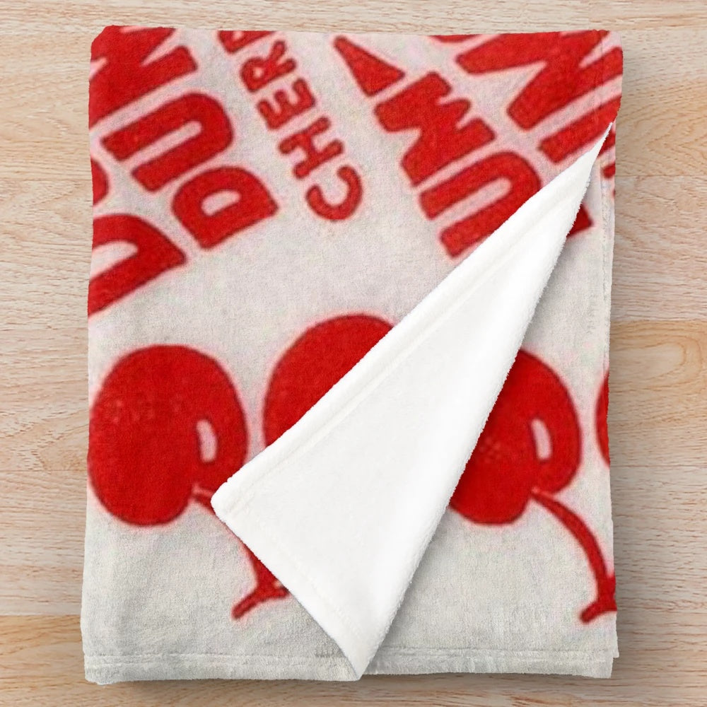 Cherry dum dum plush blanket with a lollipop design