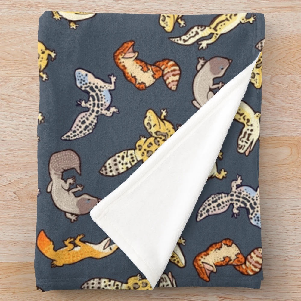 Dark grey plush blanket with chub gecko pattern