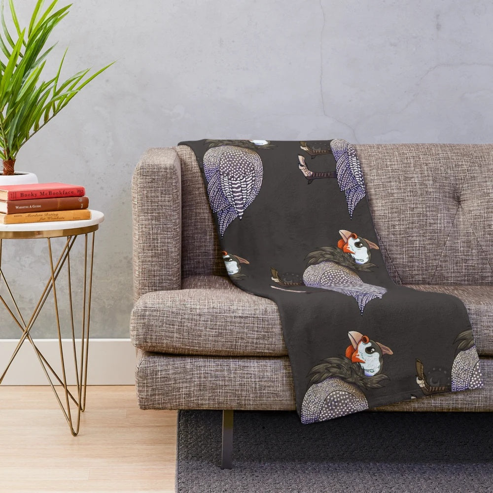 A soft and plush blanket featuring the beautiful helmeted guinea fowl bird design