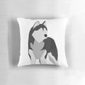 A soft and plush pillow featuring the fluffy and adorable features of a Siberian husky.