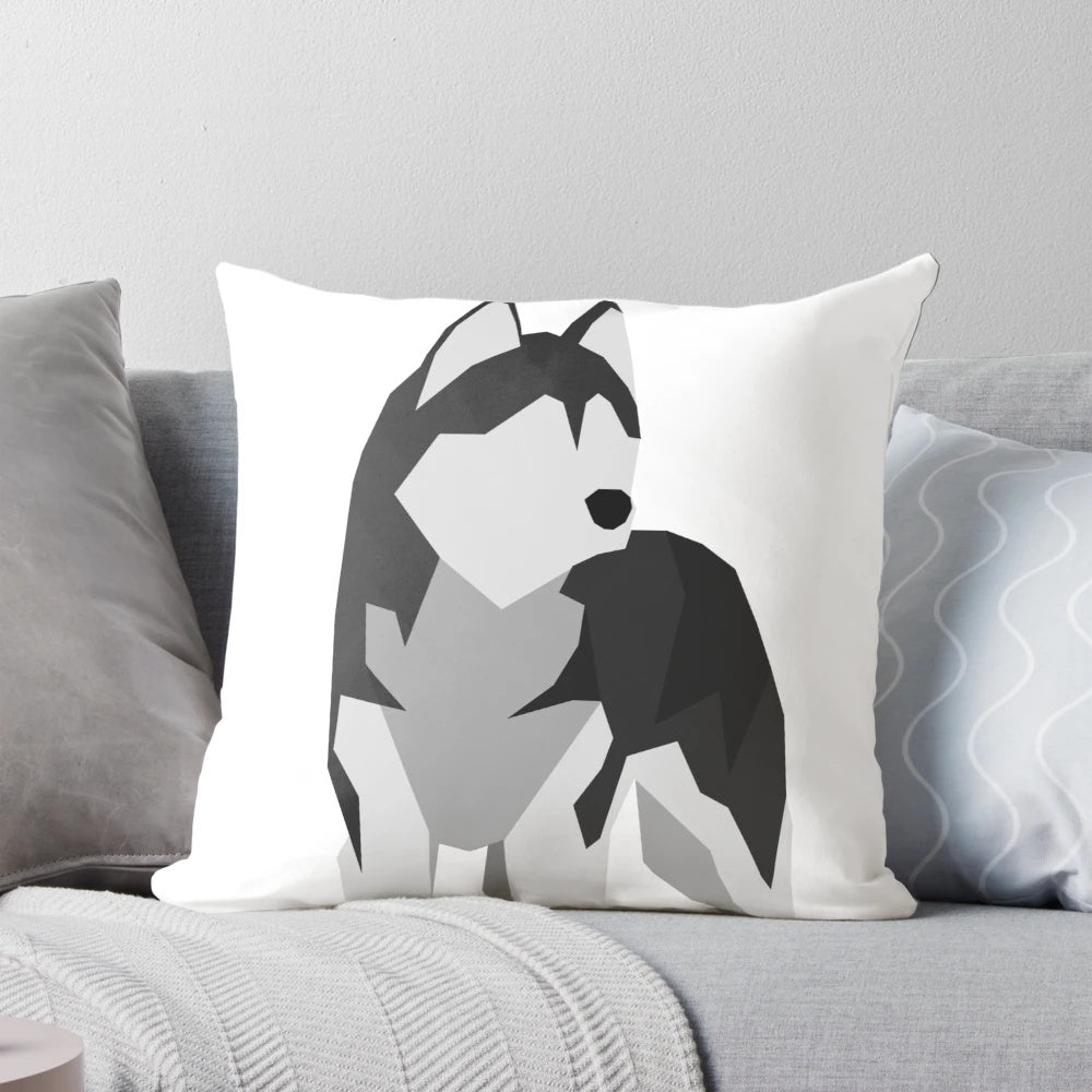 A soft and plush pillow featuring the fluffy and adorable features of a Siberian husky.