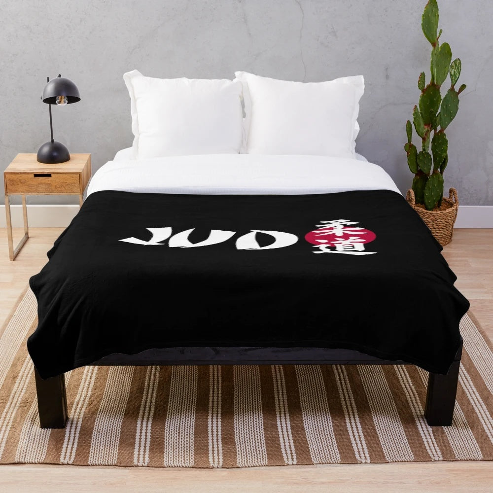 Judo plush blanket with a red and black design