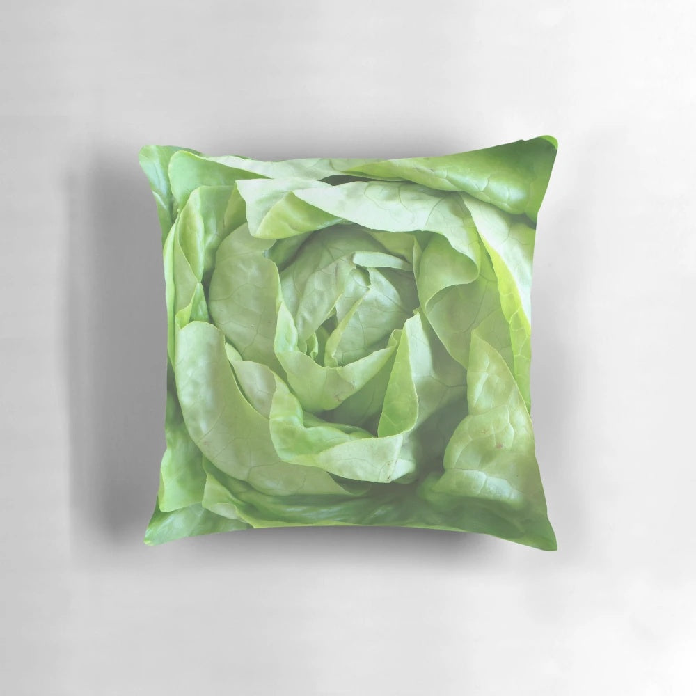A plush, green lettuce-shaped pillow for comfortable and decorative home accents.