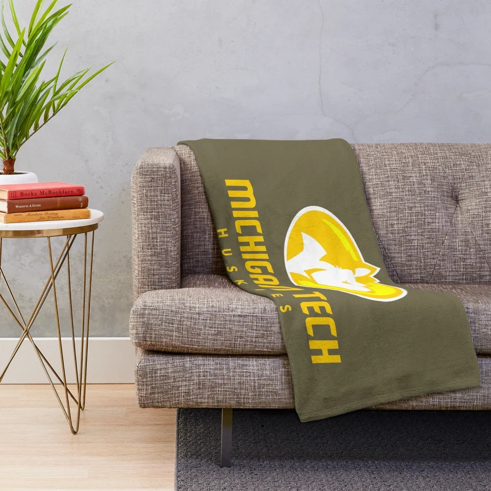 Soft and comfortable plush blanket in Michigan Tech colors