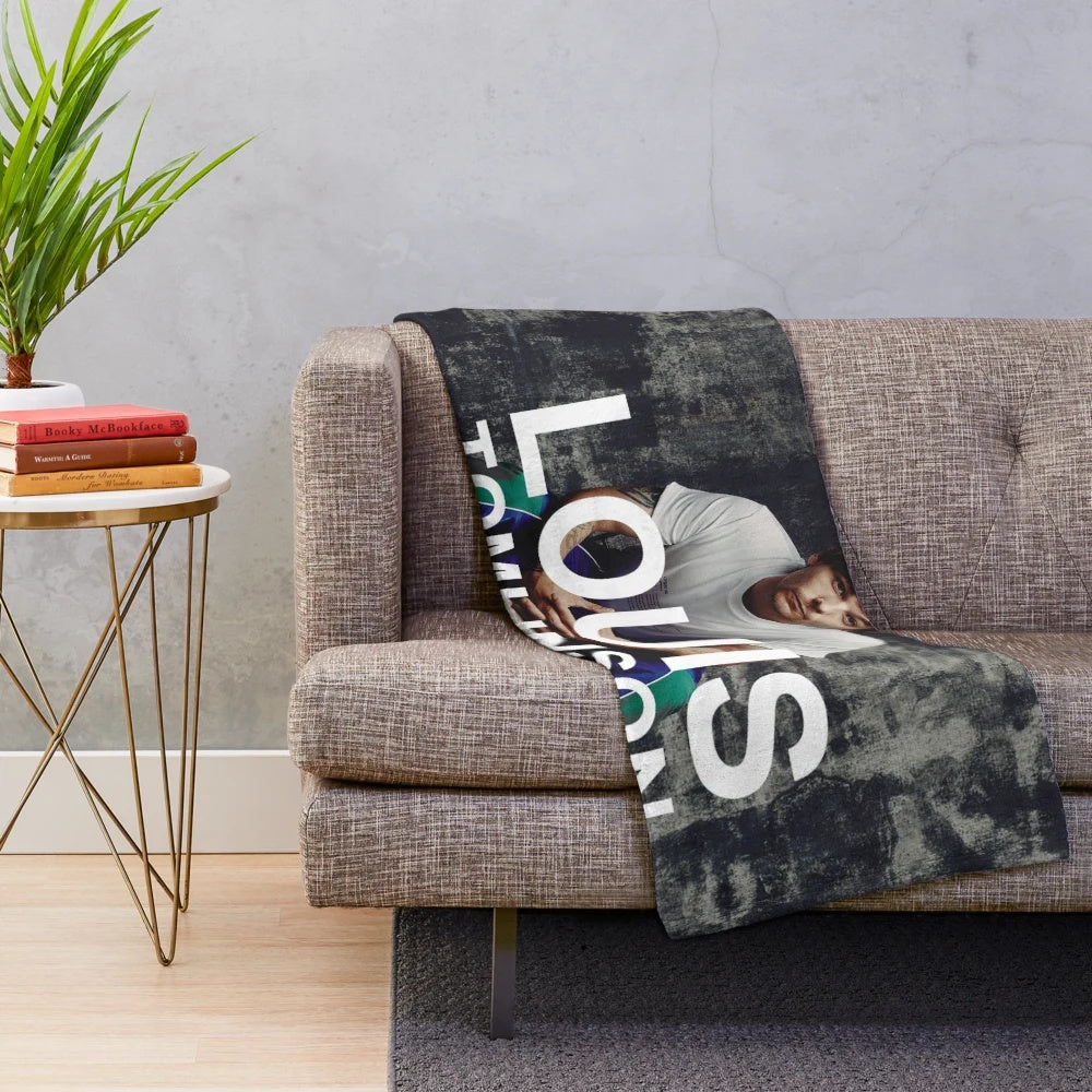 Plush blanket with Endah New Tomlinson Walls inspired design